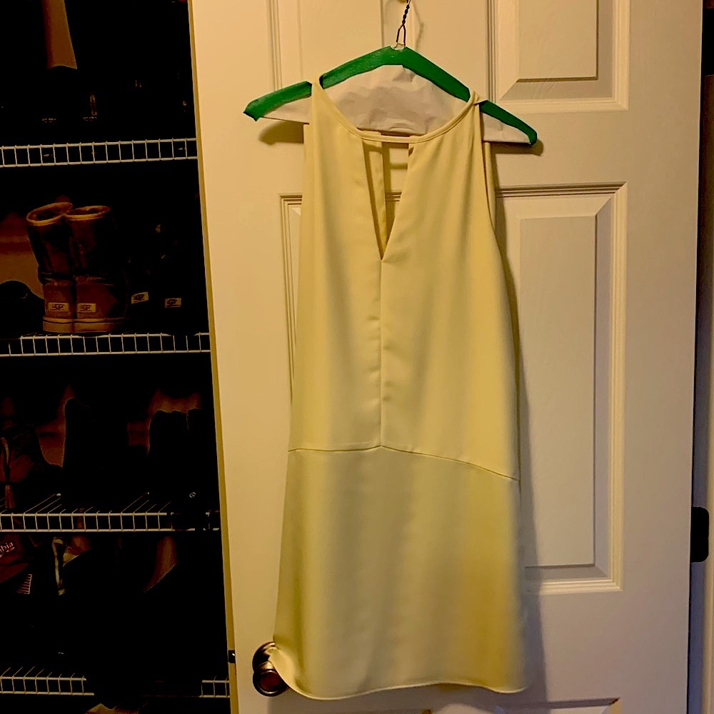 Light yellow mid thigh dress.